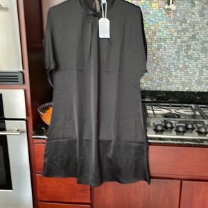 NWT black size S dress mid length with short sleeves.
